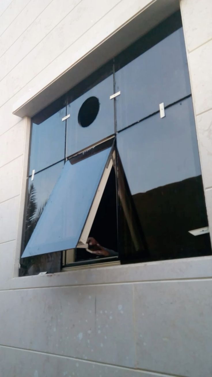 Porte vitrée double battant aluminium noir entrée moderne